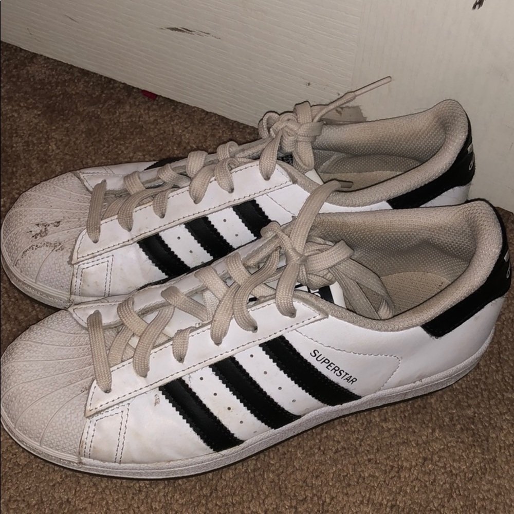 White and black Adidas shoes